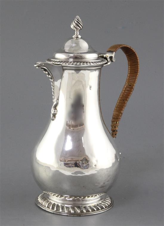A late Victorian silver baluster hot water pot by Charles Stuart Harris, gross 18 oz.